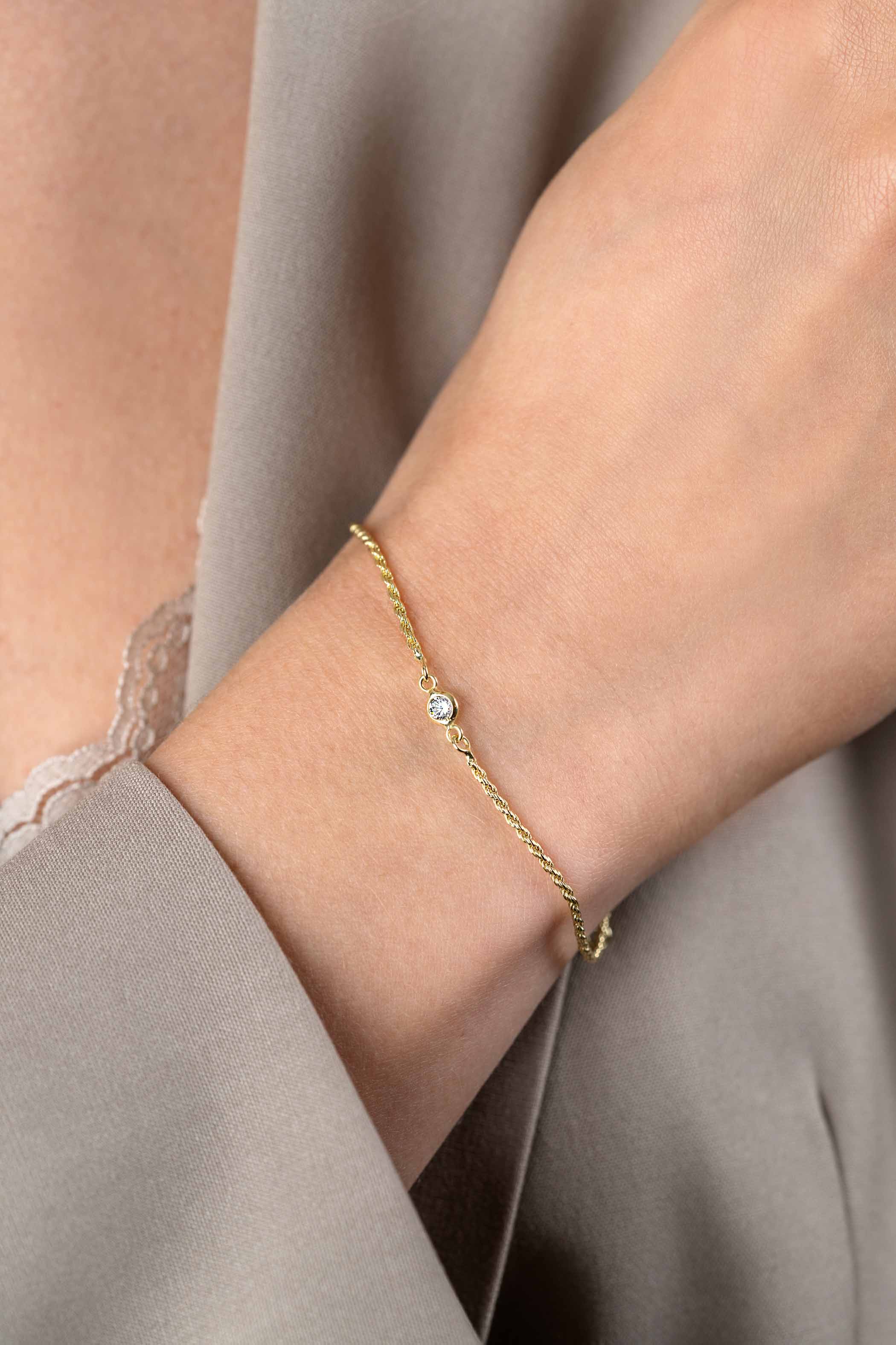 ZINZI gold plated zilveren koord armband bezet met een ronde witte zirconia 17-20cm ZIA2461Y