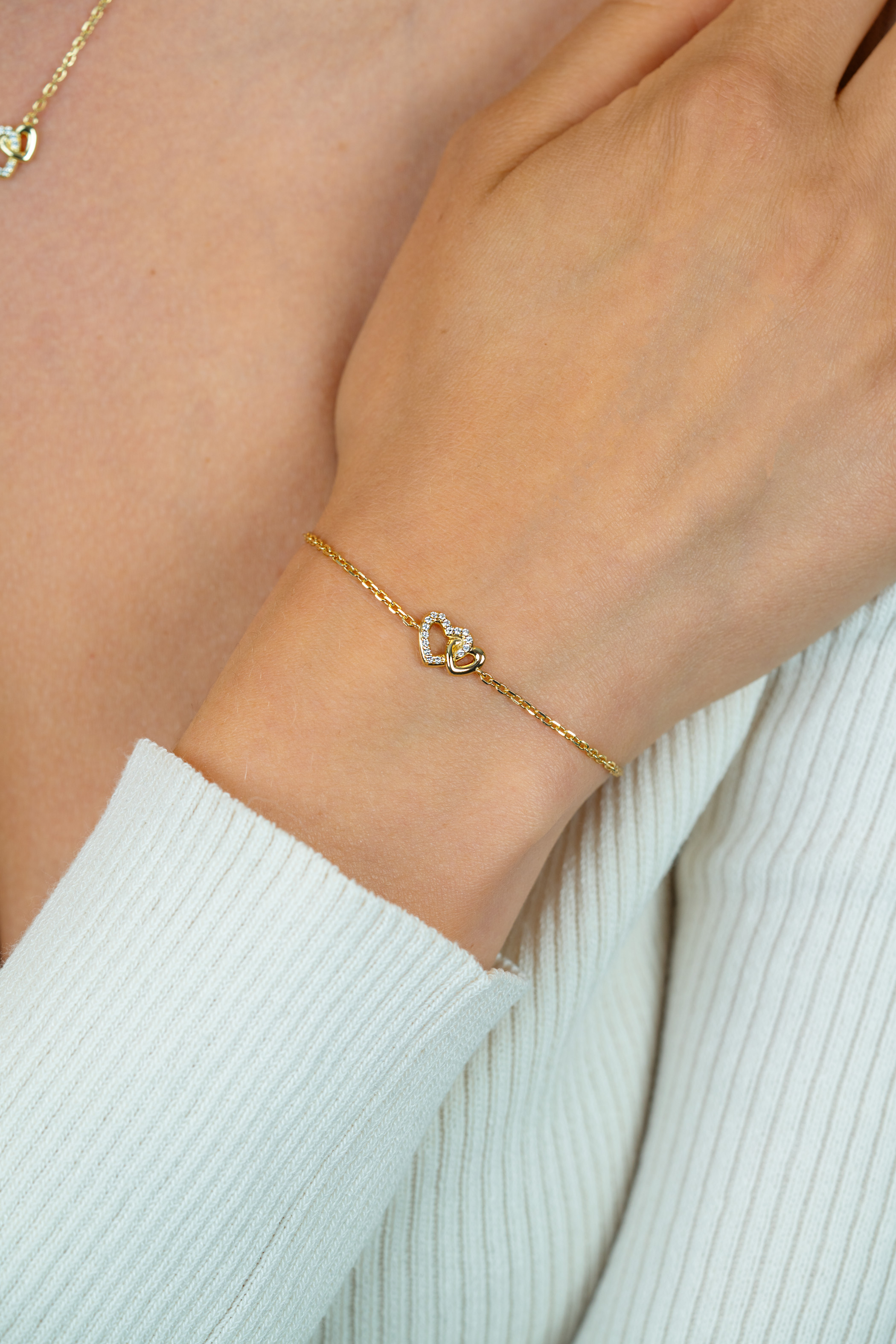 ZINZI gold plated zilveren armband met verbonden hartjes, witte zirkonia's 17-19cm ZIA2493Y