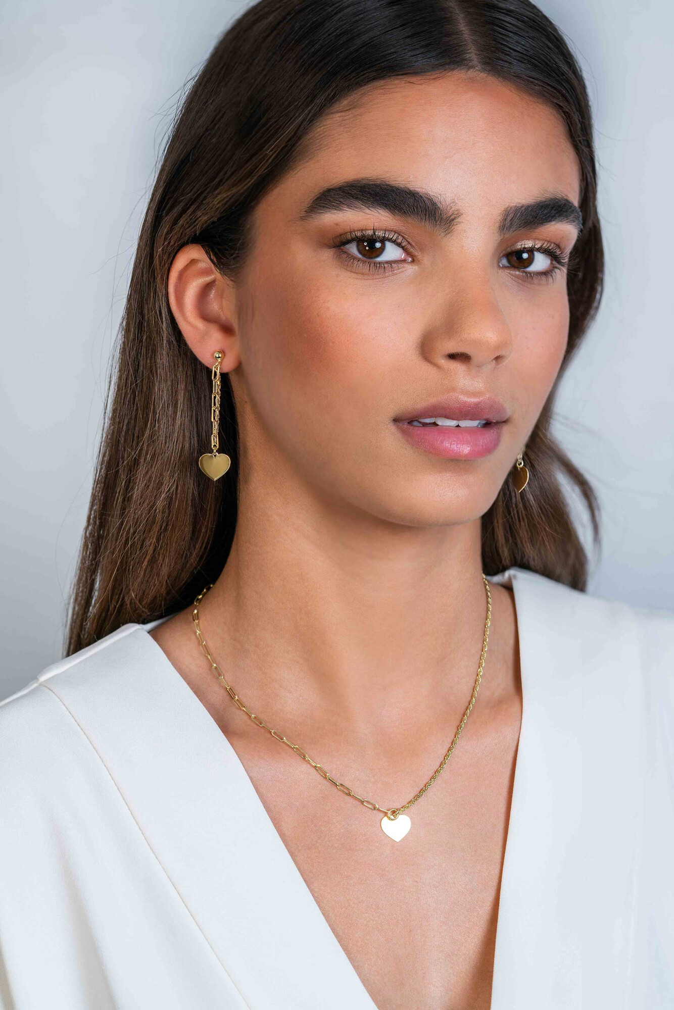 ZINZI gold plated zilveren oorstekers 52mm lang met twee trendy schakels en glad hart ZIO2381G
