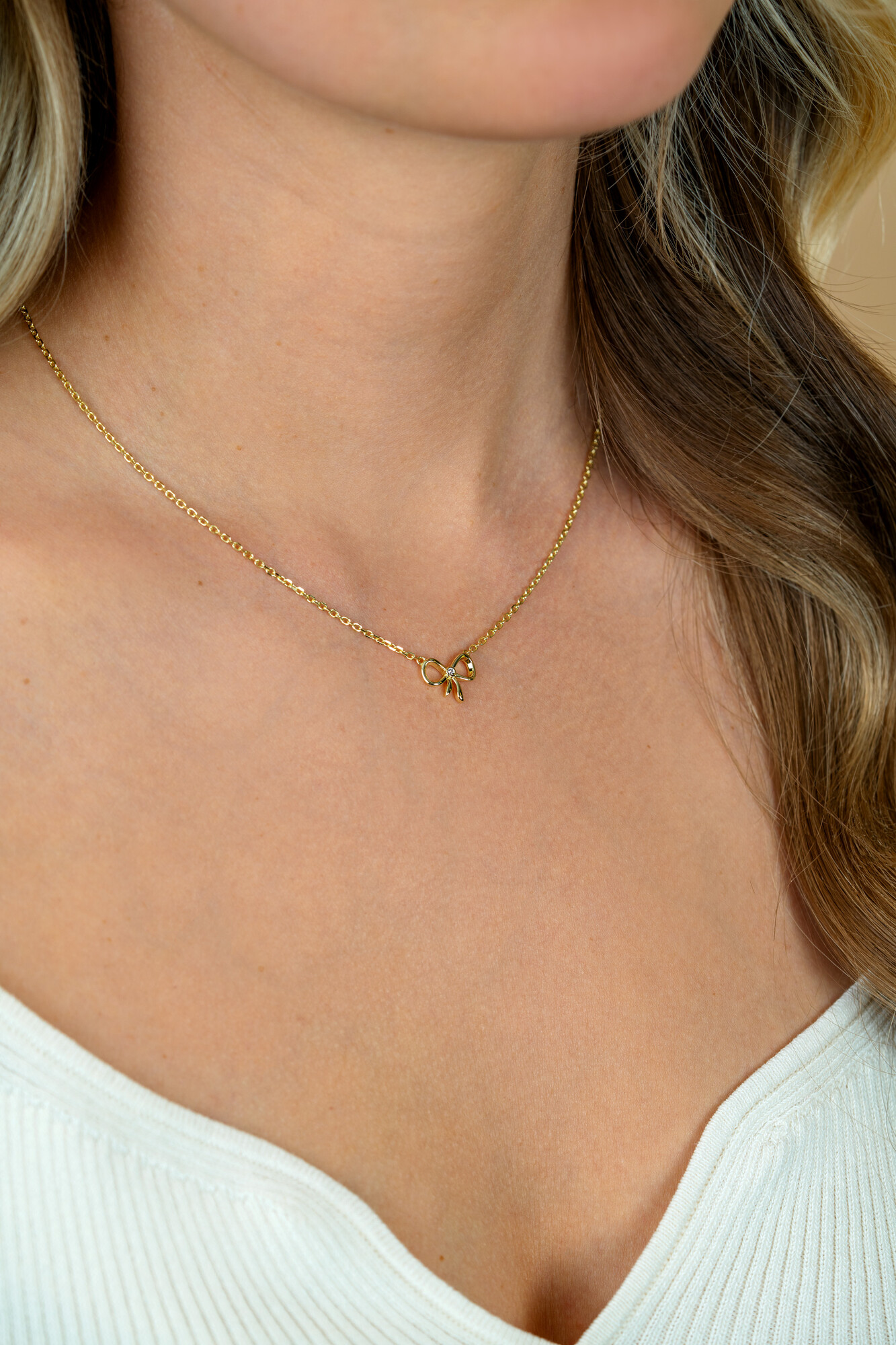 ZINZI gold plated zilveren ketting 42–45cm met sierlijke strik, bezet met witte zirkonia ZIC2724Y