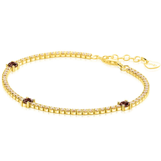 ZINZI gold plated zilveren tennisarmband 2,1mm breed bezet met champagnekleurige zirkonia’s in verfijnde rijzetting, afgewisseld met drie grotere donkerbruine kleurstenen (4,3mm) in chatonzetting ZIA2894C