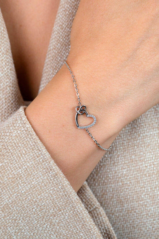 ZINZI zilveren armband met twee sierlijke harten die met elkaar verbonden zijn, ook bezet met witte zirkonia's 17-20cm ZIA2874