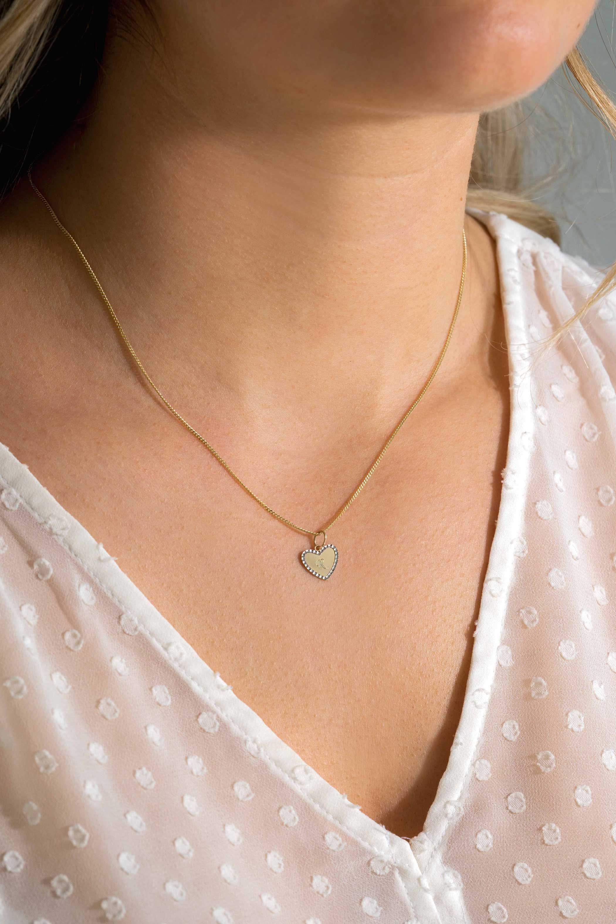 10mm ZINZI Gold 14 krt gouden hanger met glanzend hartje van 10mm en met chique witgouden parelrand ZGH364-10 (zonder collier)